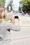 Woman photographing city\'s attractions