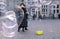 Woman photographing a crowd of soap bubbles in Bremen Germany