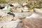 Woman photographing a river