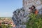 Woman photographing on a rocky lookout