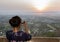 Woman photographing sunset