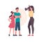 A woman photographs children on a camera with a flash, sister and brother pose for a photo. Cartoon characters. A mother