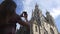 Woman photographs Stephansdom in Vienna