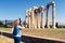 Woman photographs the Temple of Olympian Zeus, Athens