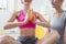 Woman in physical therapy exercising with spiked ball