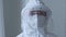 Woman physician doctor scientist nurse wears white uniform transparent protective face shield from coronavirus infection
