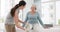 Woman, physiotherapist and legs rehabilitation of senior patient, medical advice and physical therapy services