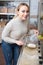 Woman picking cereals in organic store