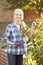 Woman picking fruit on allotment