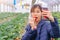 Woman picking up strawberry and eating strawberry buffet in Sendai hydroponic strawberry farm