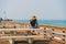 Woman on a pier. From the center of the Pismo Beach city out into the Pacific ocean Pismo Beach pier gives visitors a grand view.