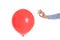 Woman piercing red balloon on white background