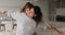 Woman piggyback daughter spread arms like airplane wings play indoor