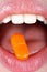 Woman with Pill on Tongue