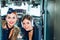 Woman pilot in aviation headsets. Pretty Stewardess. Portrait of attractive young woman pilot in cockpit. Portrait of