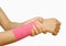 Woman with pink banage having pain in her wrist