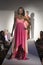 Woman In Pink Dress On Fashion Catwalk