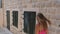 Woman In A Pink Dress Walks Down The Stairs Of Ancient Stone Town, Back View