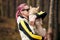 Woman with pink hair hugs beloved Siberian Husky puppy, true love of human and pet