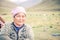 Woman with pink headcloth in Kyrgyzstan