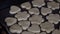 A woman places cookies from rolled dough on a baking sheet. Close-up shot