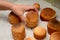 woman places ready-made Easter cakes on white napkins. The concept of a holiday, homemade food