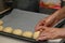 woman placing buns on a baking sheet 1