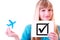 Woman, plane and check symbol