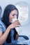 Woman on the plane vomited in a paper bag