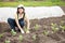 Woman planting cabbage seedling