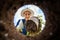 Woman planting a flower in the garden soil hole. view from underground