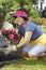 Woman Planting Flower Plant