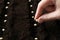 Woman planting peas into fertile soil, closeup. Vegetable seeds