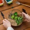 Woman planting succulents in florarium, closeup, crop