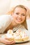 Woman with plate of cakes