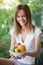 Woman with plate of fruits