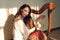 Woman play celtic harp