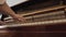 Woman play on open vintage wooden piano