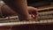 Woman play on open vintage wooden piano