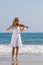 Woman play violin on beach