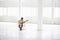 Woman Playing An Acoustic Guitar In Spacious Warehouse