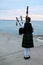 Woman playing the Bagpipes at Lake Huron in Kincardine