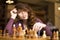 Woman playing chess indoor and thinking position, find winning move, strategy