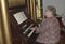 A woman playing the church`s organ in a church in Annapolis, Maryland