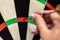 Woman playing dart, professional steeldart sport, closeup dartboard and hand