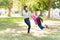 Woman Playing With Daughter At Park On Sunny Day