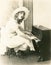 Woman playing a miniature piano