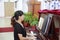 Woman playing piano in the church