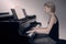 Woman playing piano class profile