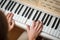 Woman Playing Piano shallow DOF; color toned image